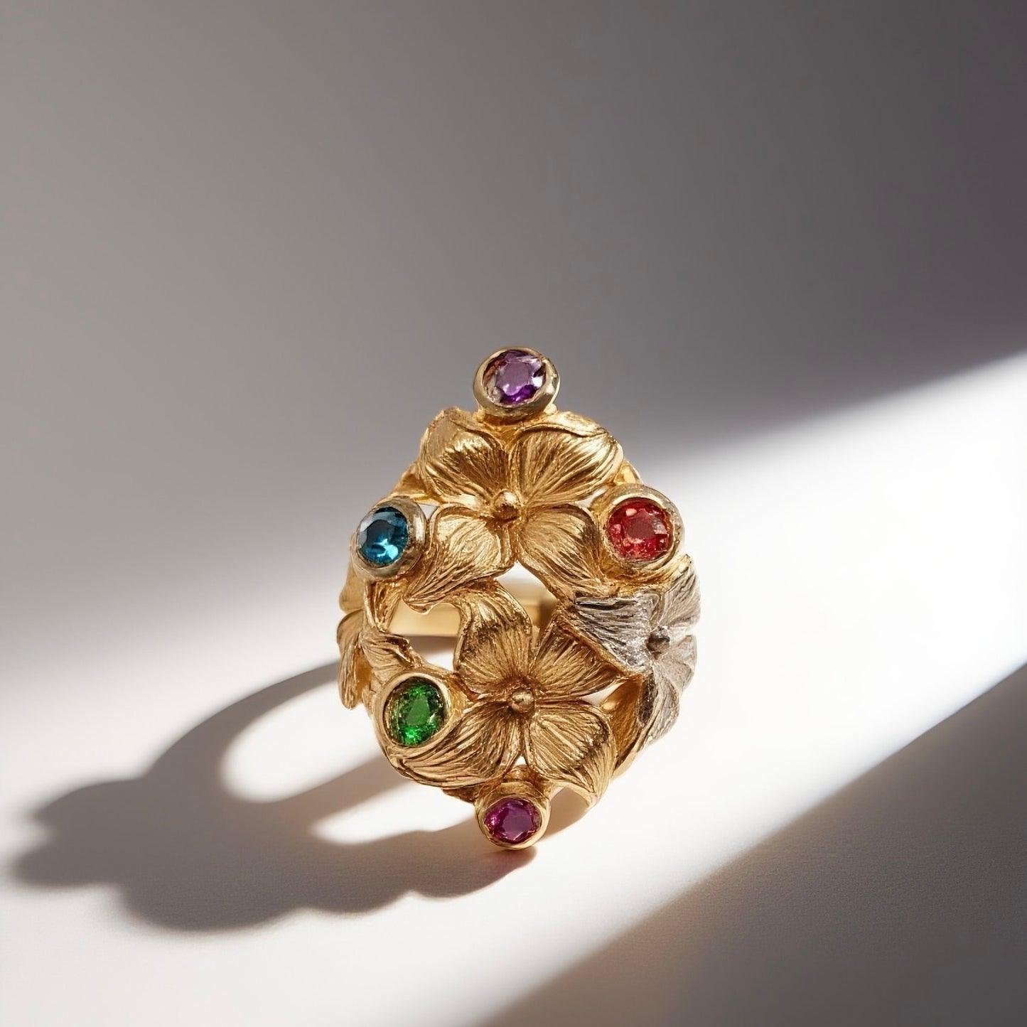 Vintage British 1950s brass open ring with red blue green purple rhinestone flower pattern court retro style